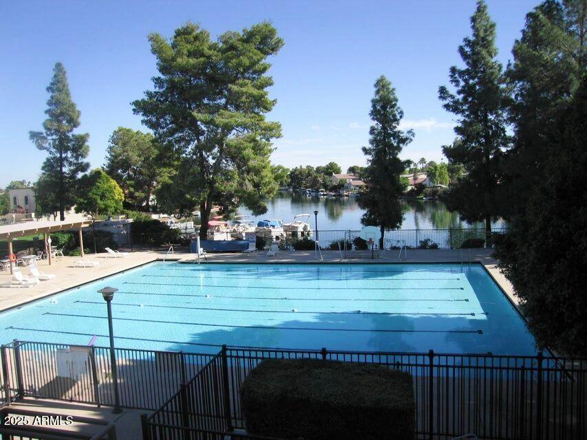 1529 East Edgewater Drive Tempe, AZ 85283 - Photo 28 of 34 a view of a swimming pool with a chair