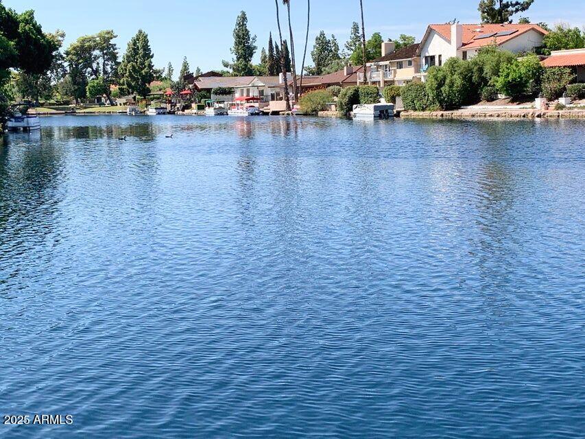 1529 East Edgewater Drive Tempe, AZ 85283 - Photo 29 of 34 a view of a lake with houses