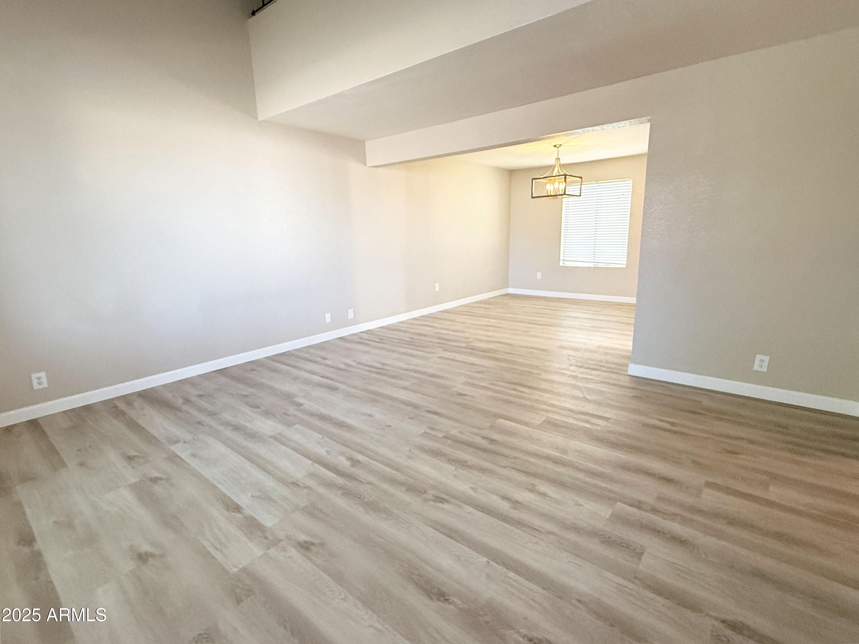 1529 East Edgewater Drive Tempe, AZ 85283 - Photo 3 of 34 wooden floor in an empty room