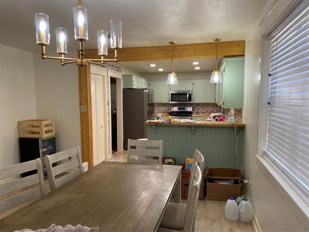 2802 Westover Road Shreveport, LA 71108 - Photo 2 of 33 a kitchen with kitchen island stainless steel appliances a sink stove and refrigerator