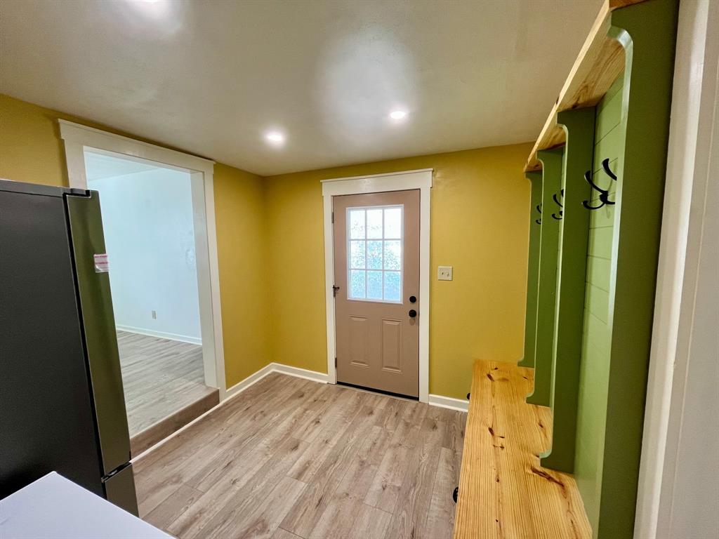 2802 Westover Road Shreveport, LA 71108 - Photo 26 of 33 a view of hallway with stainless steel appliances wooden floor and door