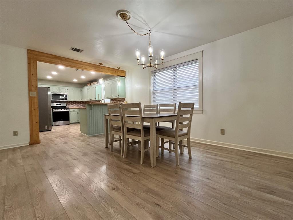 2802 Westover Road Shreveport, LA 71108 - Photo 8 of 33 a view of a dining room with furniture window and wooden floor