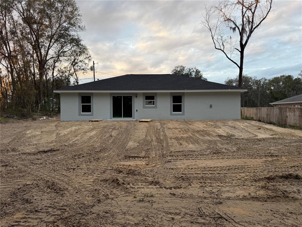 205 Emerald Road Ocala, FL 34472 - Photo 16 of 18 a view of a house with a yard