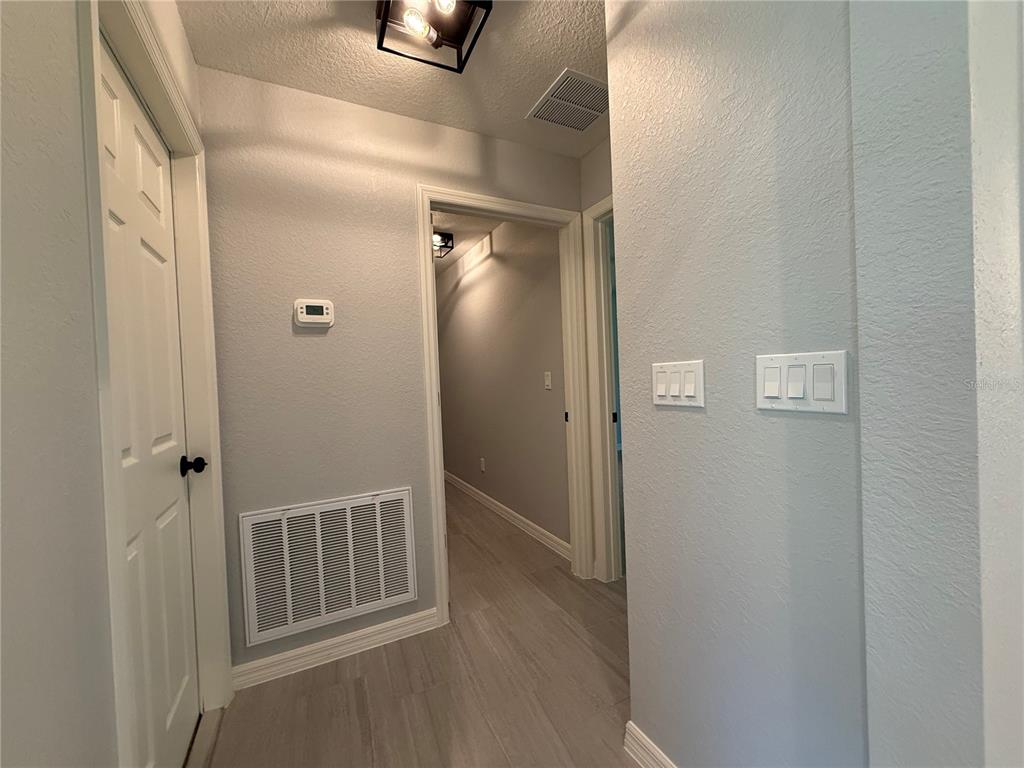 205 Emerald Road Ocala, FL 34472 - Photo 6 of 18 a view of a bathroom from a hallway