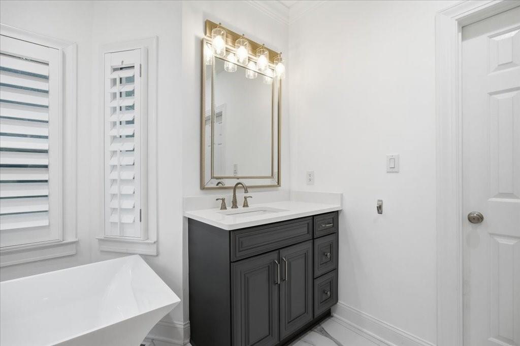 397 Thomas Road Dallas, GA 30132 - Photo 39 of 108 a bathroom with a sink a toilet and shower