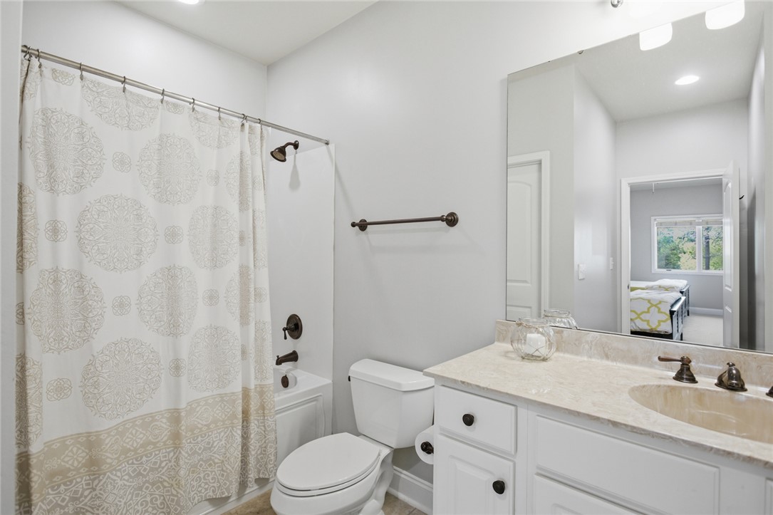 578 Sunset Point Drive West Union, SC 29696 - Photo 18 of 46 This bathroom features elegant fixtures and a pristine vanity, offering a serene personal space.