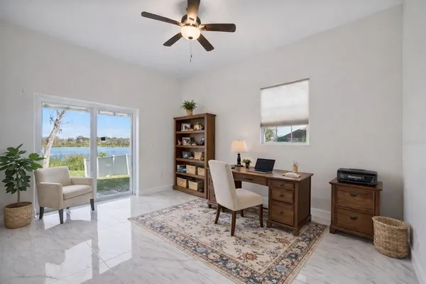a workspace with furniture and a window