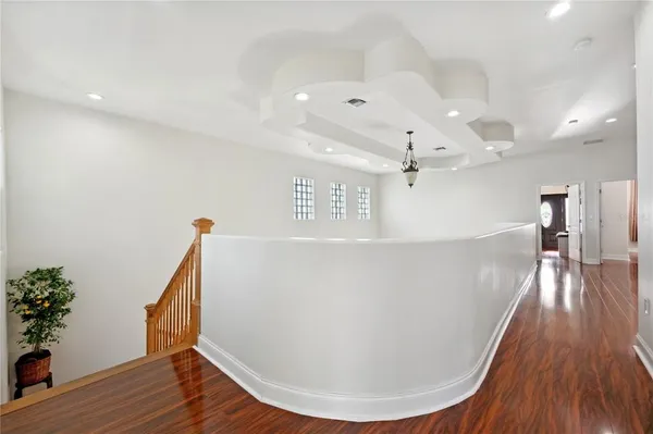 a view of entryway with wooden floor