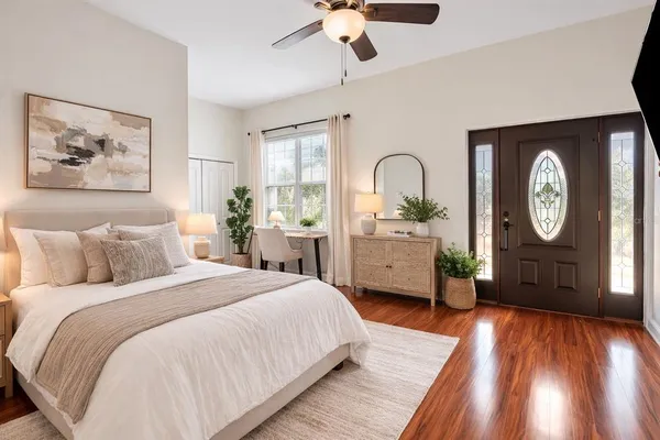 a spacious bedroom with a bed and a large dresser