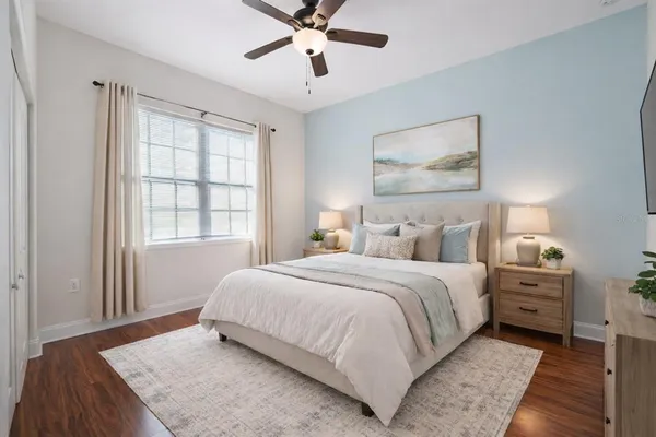 a bedroom with bed and window