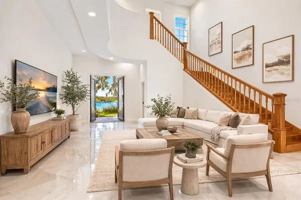 a living room with furniture and a flat screen tv