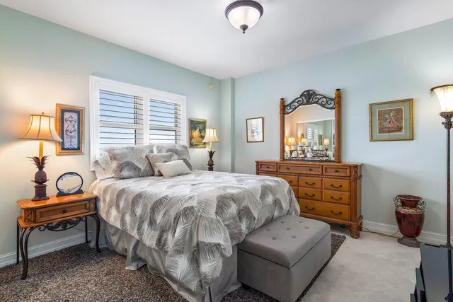 a bedroom with a bed and a dresser