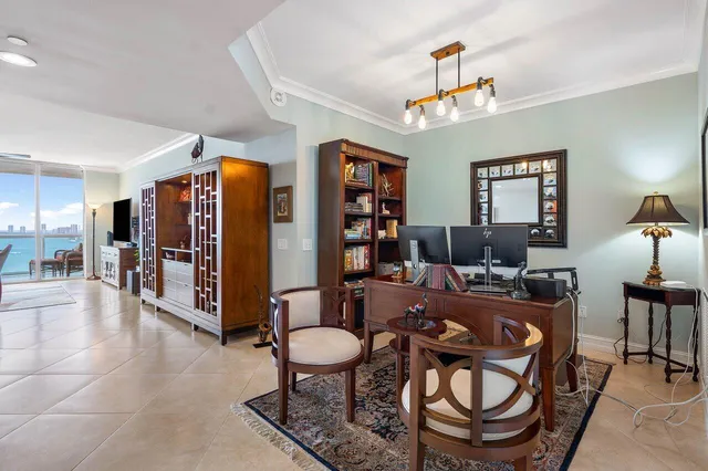 a living room with furniture a flat screen tv and rug floor