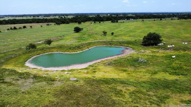 a view of a lake with a yard and lake