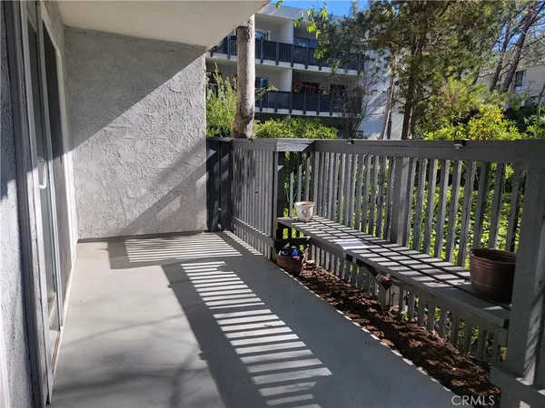 a balcony with wooden floor