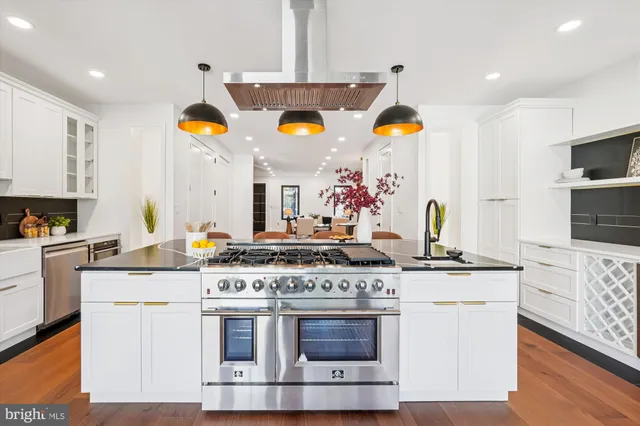 a living room with furniture and a lamp
