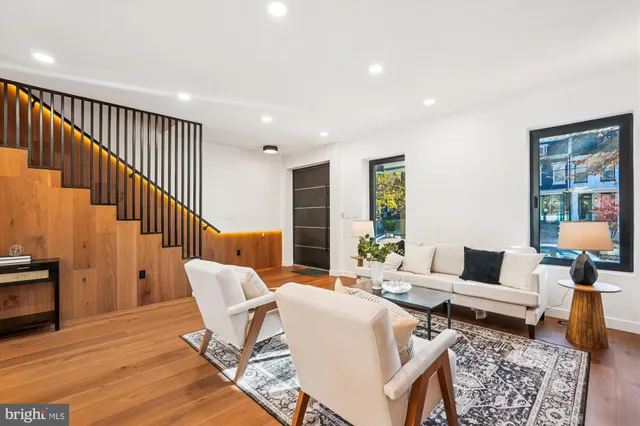 a view of staircase with wooden floor and a potted plant