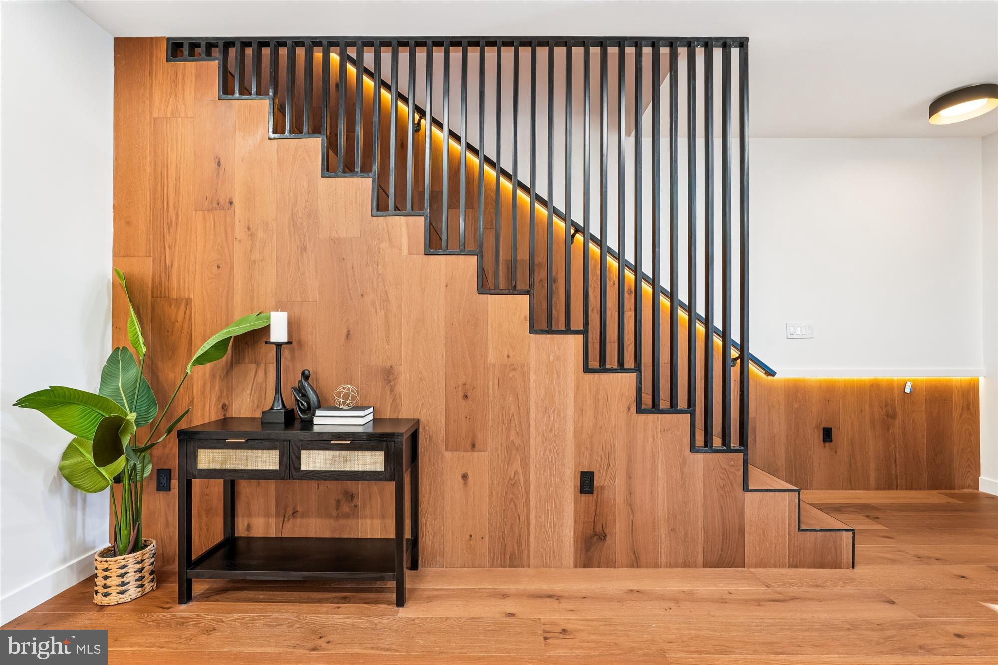 951 Shepherd Street Northwest Washington, DC 20011 - Photo 28 of 74 a view of staircase with wooden floor and a potted plant
