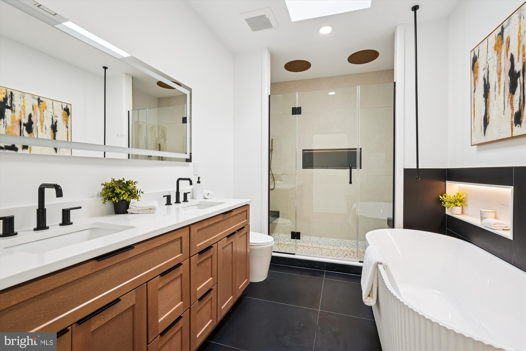 951 Shepherd Street Northwest Washington, DC 20011 - Photo 39 of 74 a bathroom with a tub sink and mirror