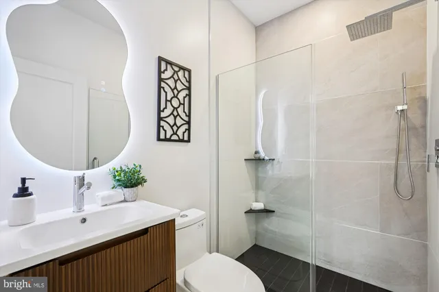 a picture of a bathroom with a shower