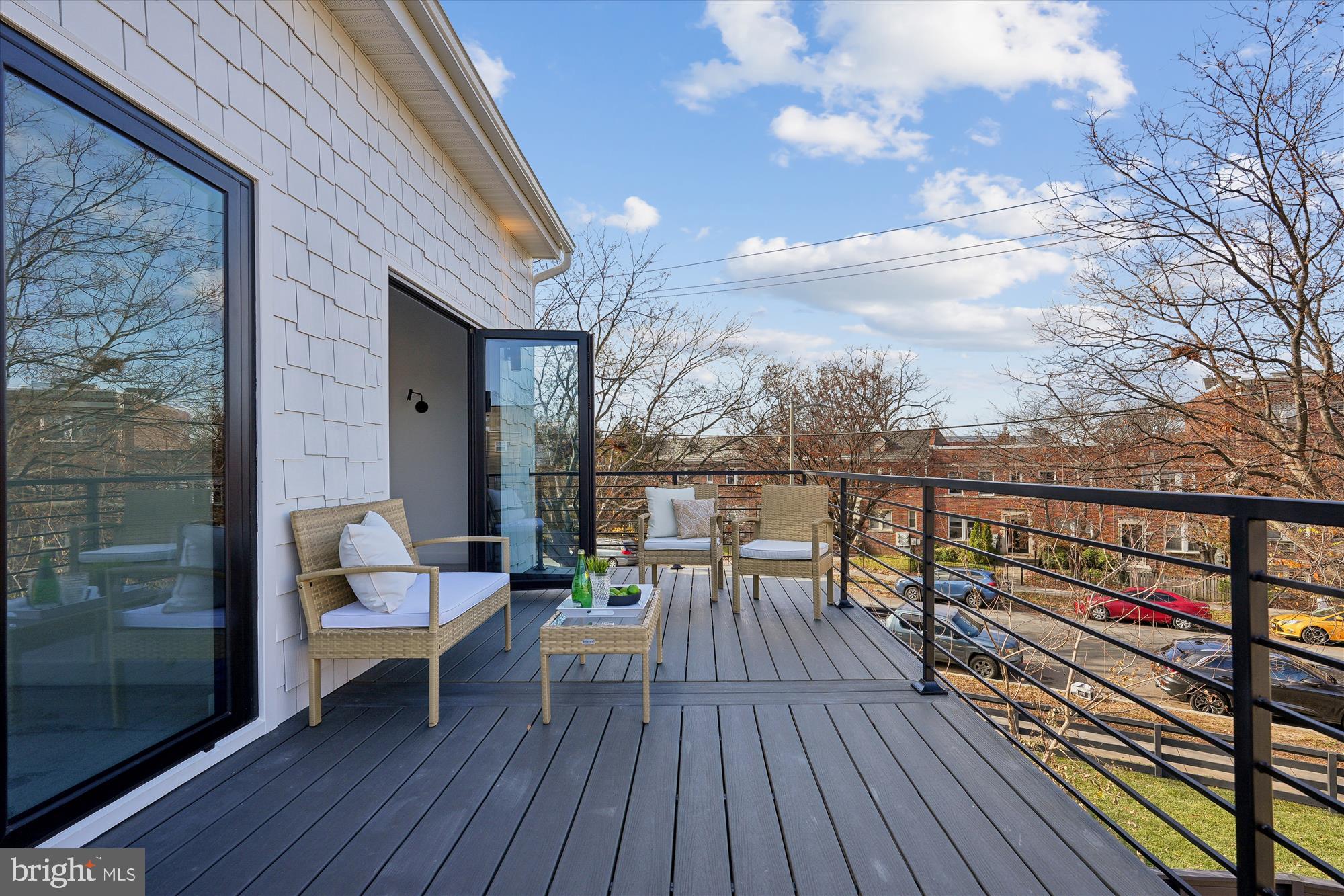 951 Shepherd Street Northwest Washington, DC 20011 - Photo 46 of 74 a view of a balcony with chairs and wooden floor