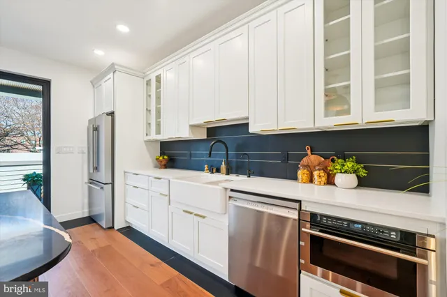 a living room with furniture a flat screen tv and closet