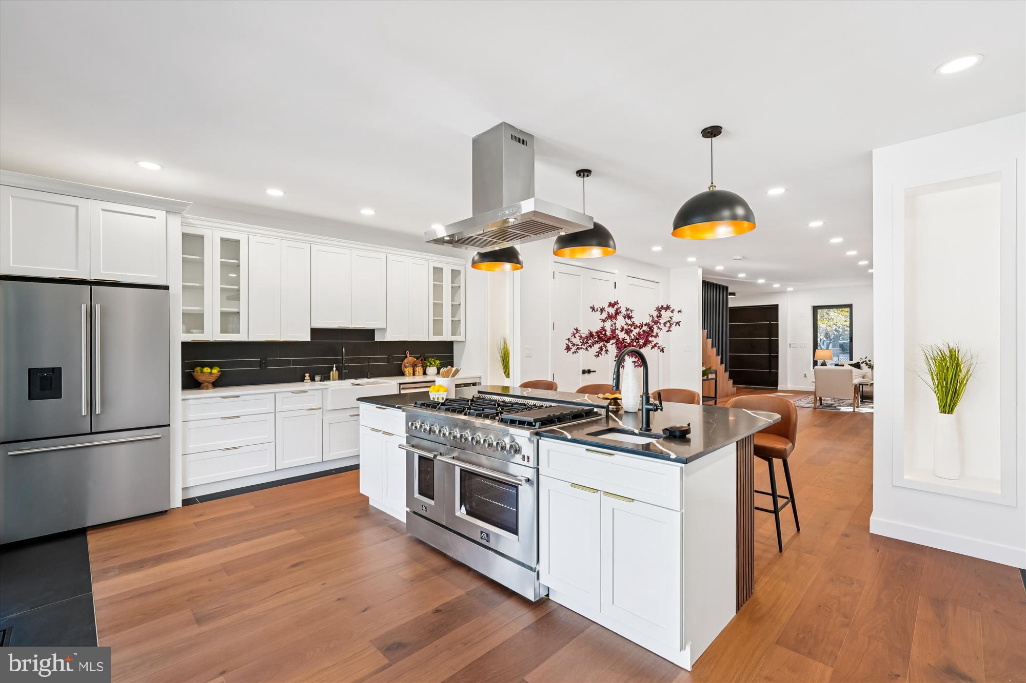 951 Shepherd Street Northwest Washington, DC 20011 - Photo 10 of 74 a kitchen with stainless steel appliances granite countertop a stove and white cabinets