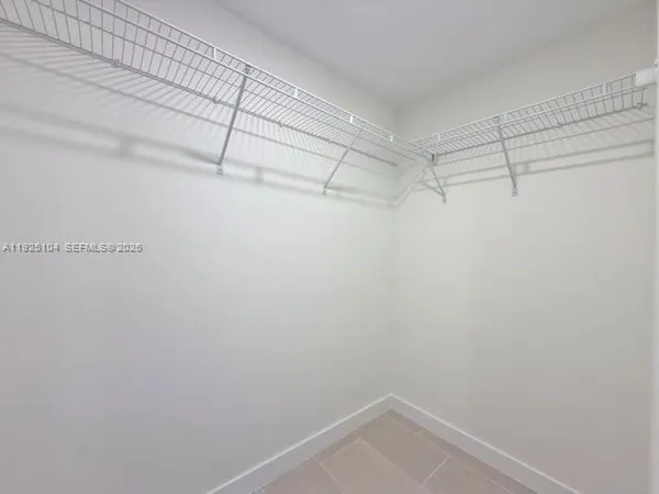 a view of a room with racks on the wall