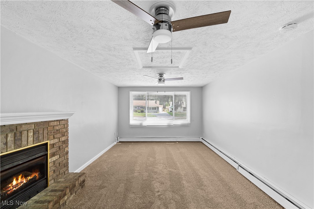 4920 Marigold Road Mentor, OH 44060 - Photo 6 of 34 Living Room with new carpeting and freshly painted interior and stylish ceiling fan