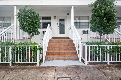 a view of a balcony with staircase
