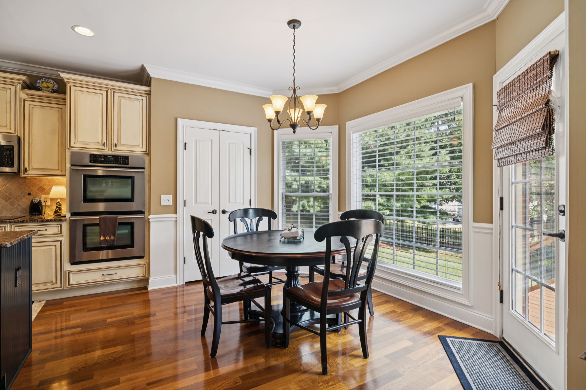 2999 Stewart Campbell Pointe Spring Hill, TN 37174 - Photo 20 of 50 a dining room with furniture window wooden floor and a chandelier
