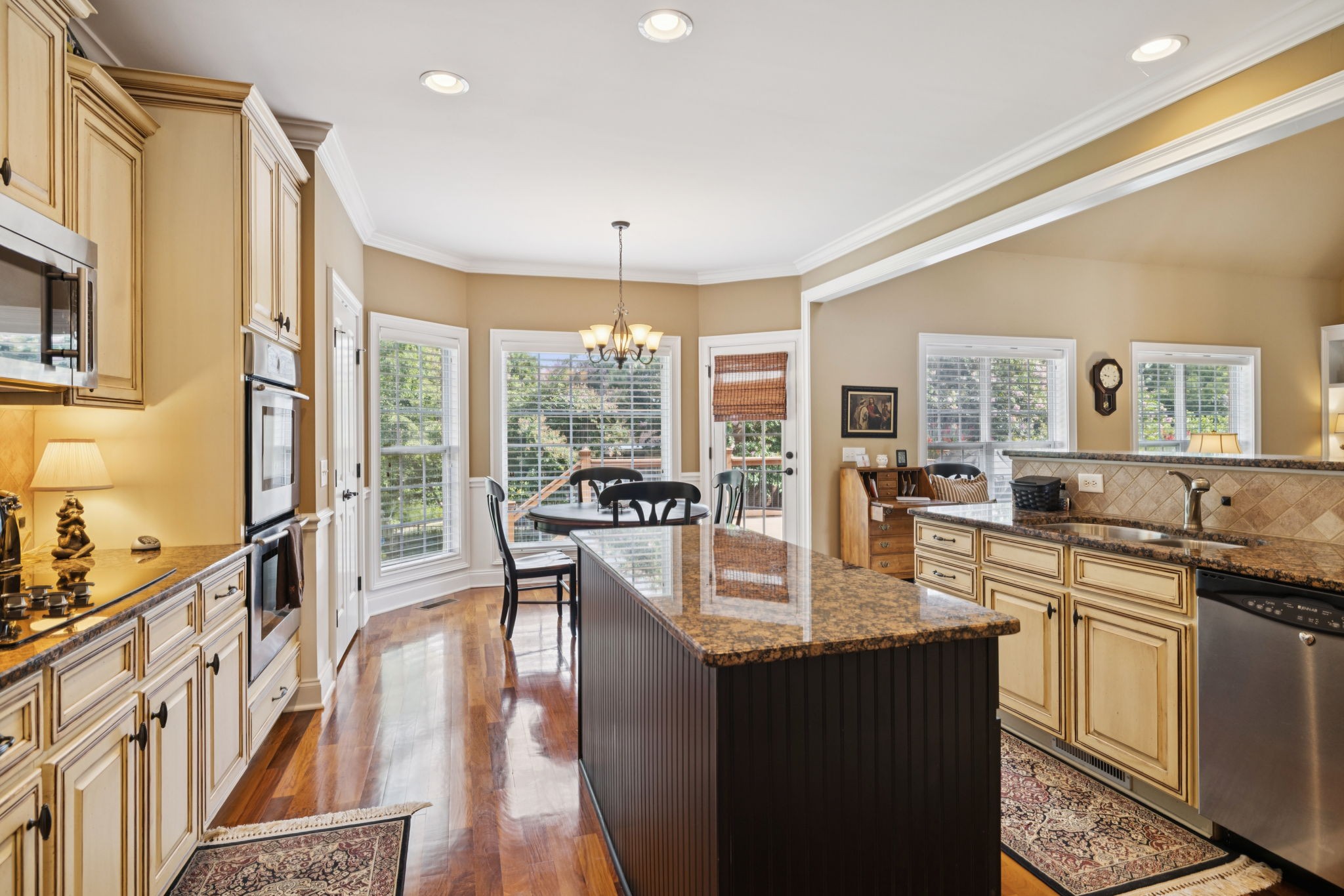 2999 Stewart Campbell Pointe Spring Hill, TN 37174 - Photo 24 of 50 a kitchen with granite countertop a sink and a stove top oven