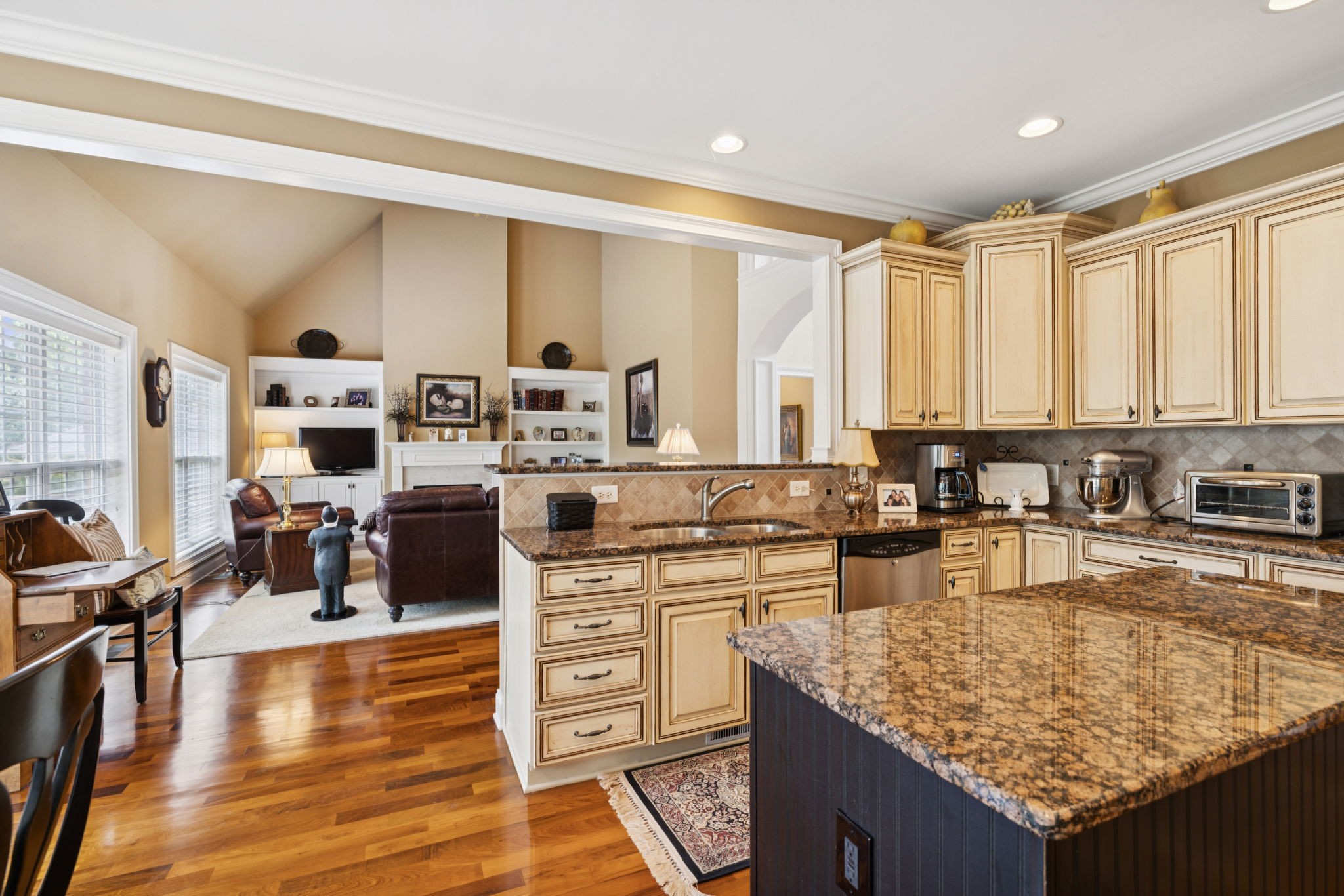 2999 Stewart Campbell Pointe Spring Hill, TN 37174 - Photo 26 of 50 a kitchen with stainless steel appliances granite countertop a stove oven and white cabinets with wooden floor