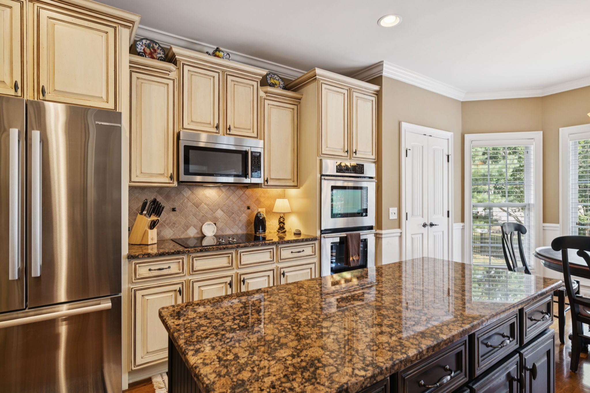 2999 Stewart Campbell Pointe Spring Hill, TN 37174 - Photo 27 of 50 a kitchen with stainless steel appliances granite countertop a refrigerator a stove and a sink with cabinets