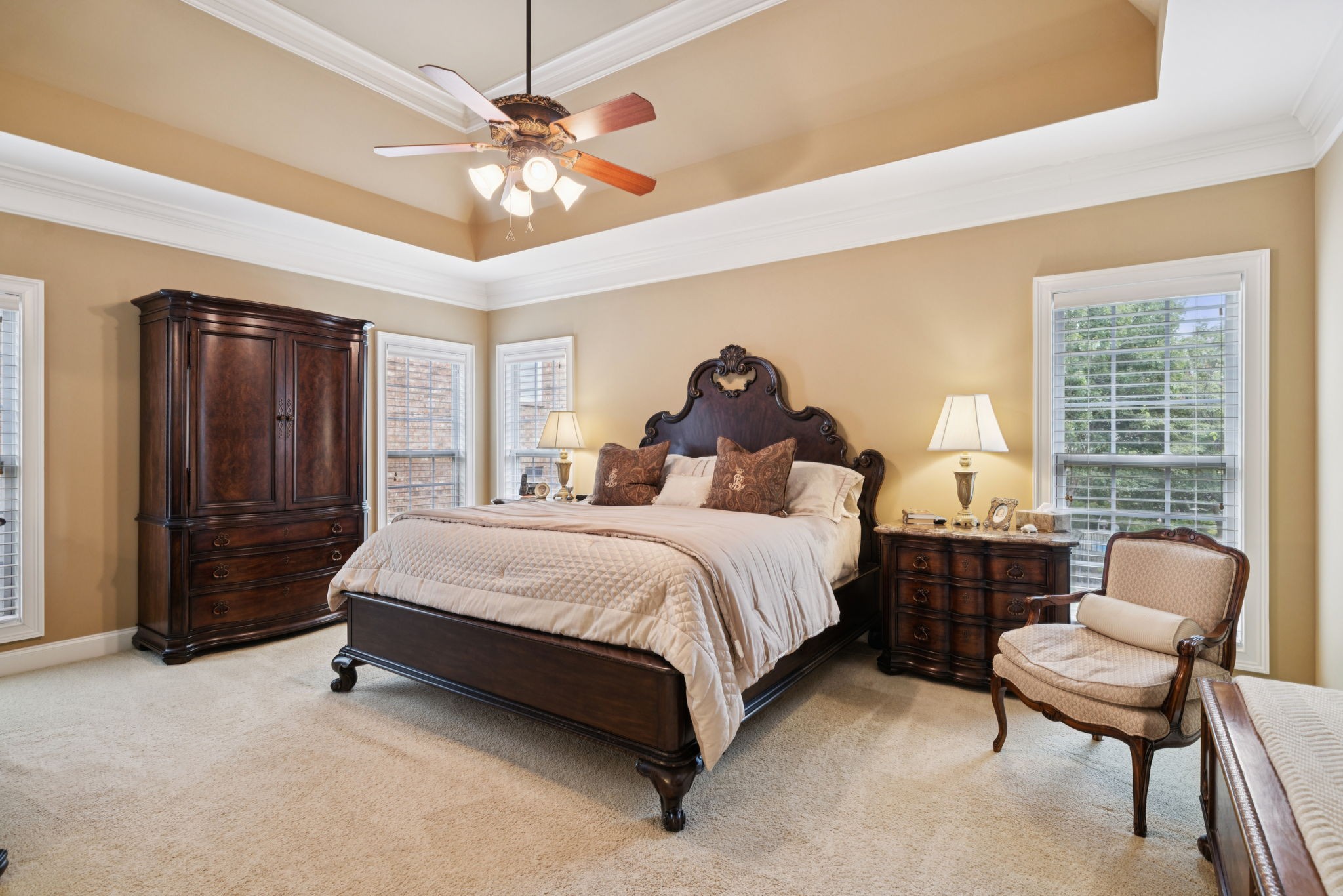 2999 Stewart Campbell Pointe Spring Hill, TN 37174 - Photo 29 of 50 a spacious bedroom with a bed and a chandelier