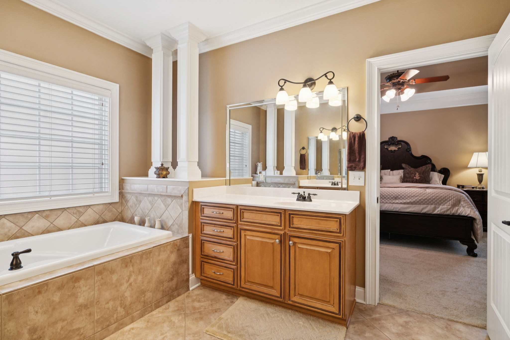 2999 Stewart Campbell Pointe Spring Hill, TN 37174 - Photo 30 of 50 a en suite bathroom with a tub double sink window and mirror