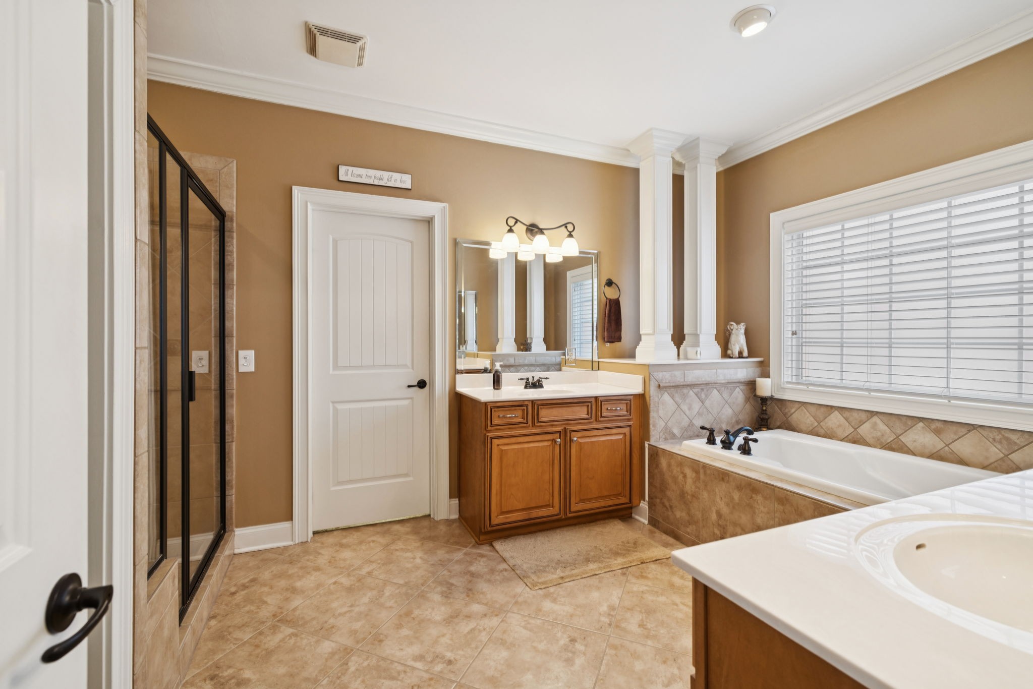 2999 Stewart Campbell Pointe Spring Hill, TN 37174 - Photo 31 of 50 a spacious bathroom with a tub a sink and mirror