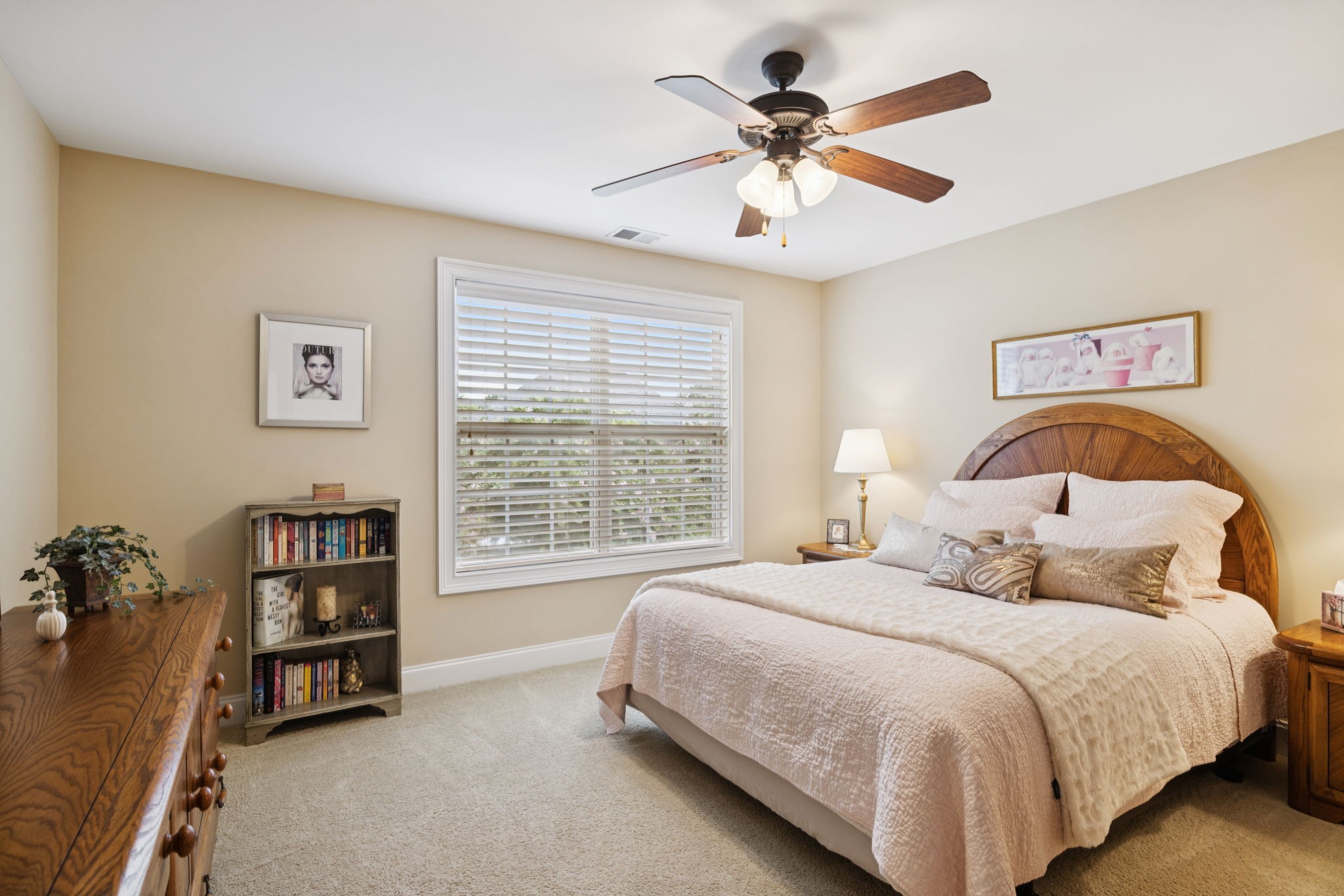 2999 Stewart Campbell Pointe Spring Hill, TN 37174 - Photo 36 of 50 a bedroom with a bed a dresser and a chandelier