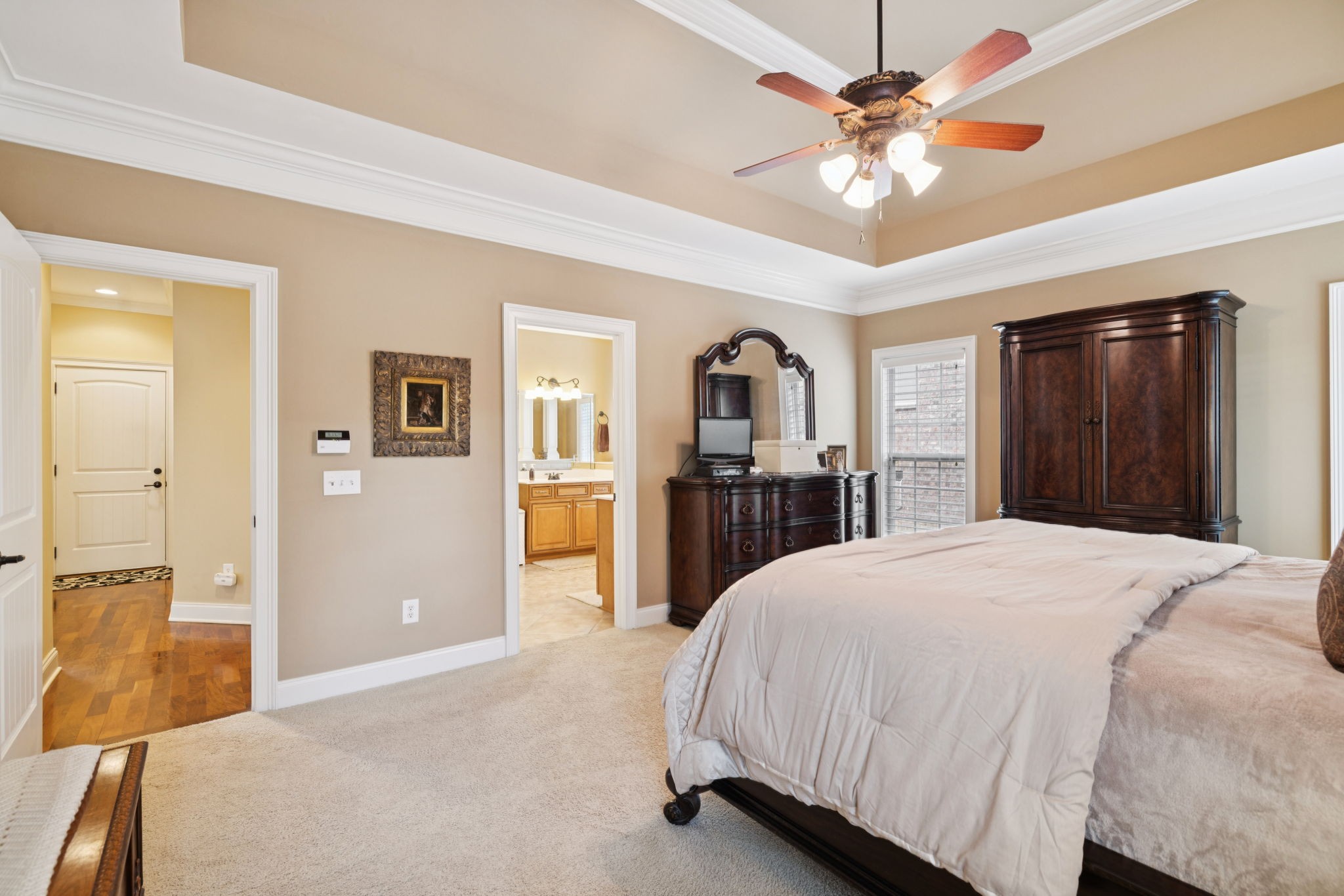 2999 Stewart Campbell Pointe Spring Hill, TN 37174 - Photo 41 of 50 a spacious bedroom with a large bed a chandelier and closet