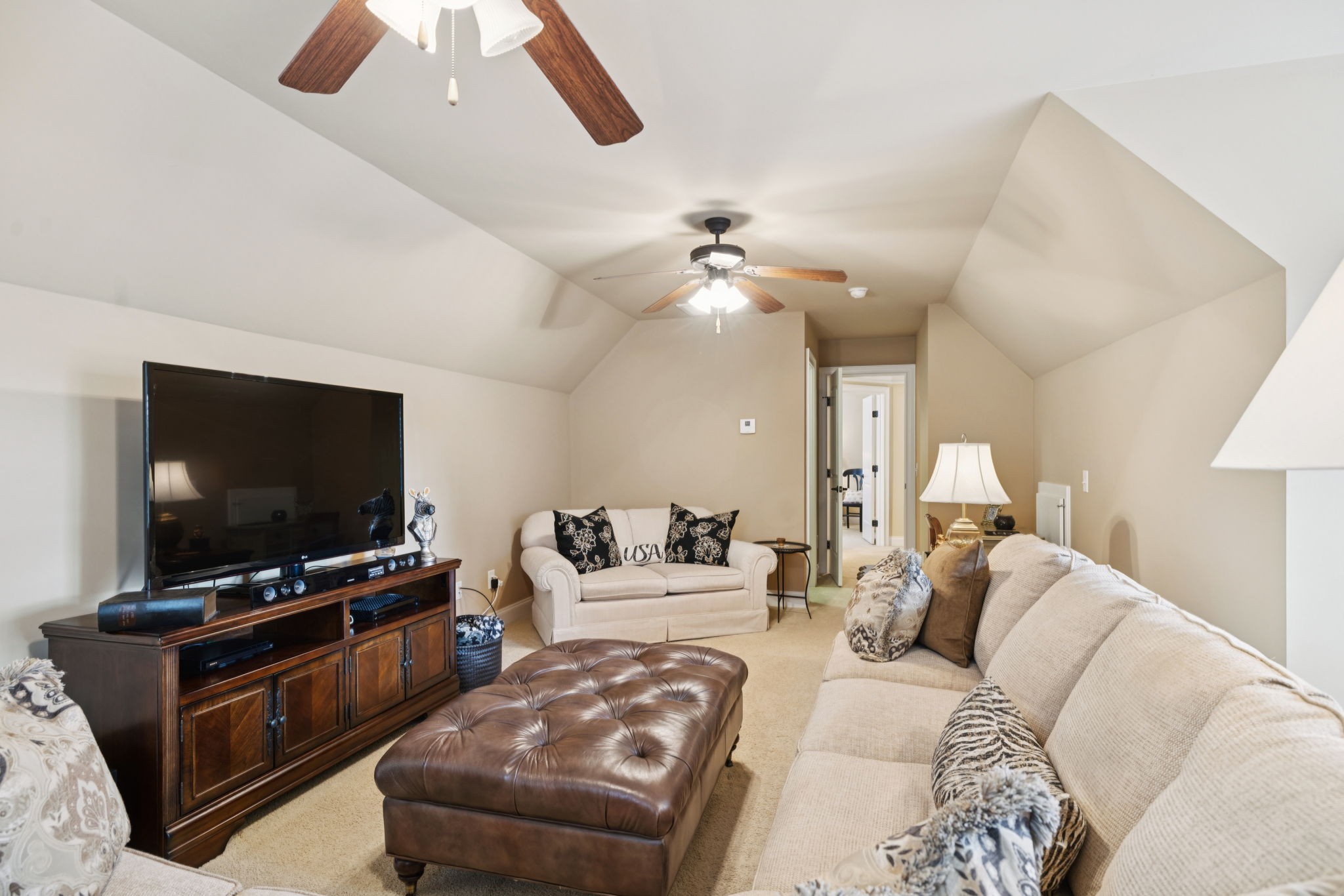 2999 Stewart Campbell Pointe Spring Hill, TN 37174 - Photo 47 of 50 a living room with furniture and a flat screen tv