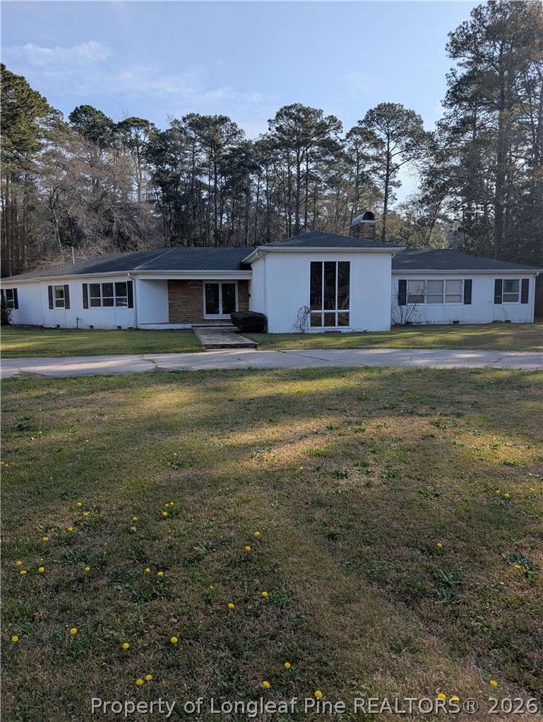 1503 Lakeview Road Fairmont, NC 28340 - Photo 2 of 30 a front view of house with yard and mountain view in back