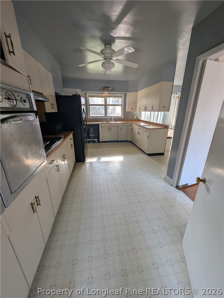 1503 Lakeview Road Fairmont, NC 28340 - Photo 9 of 30 a living room with furniture and a flat screen tv