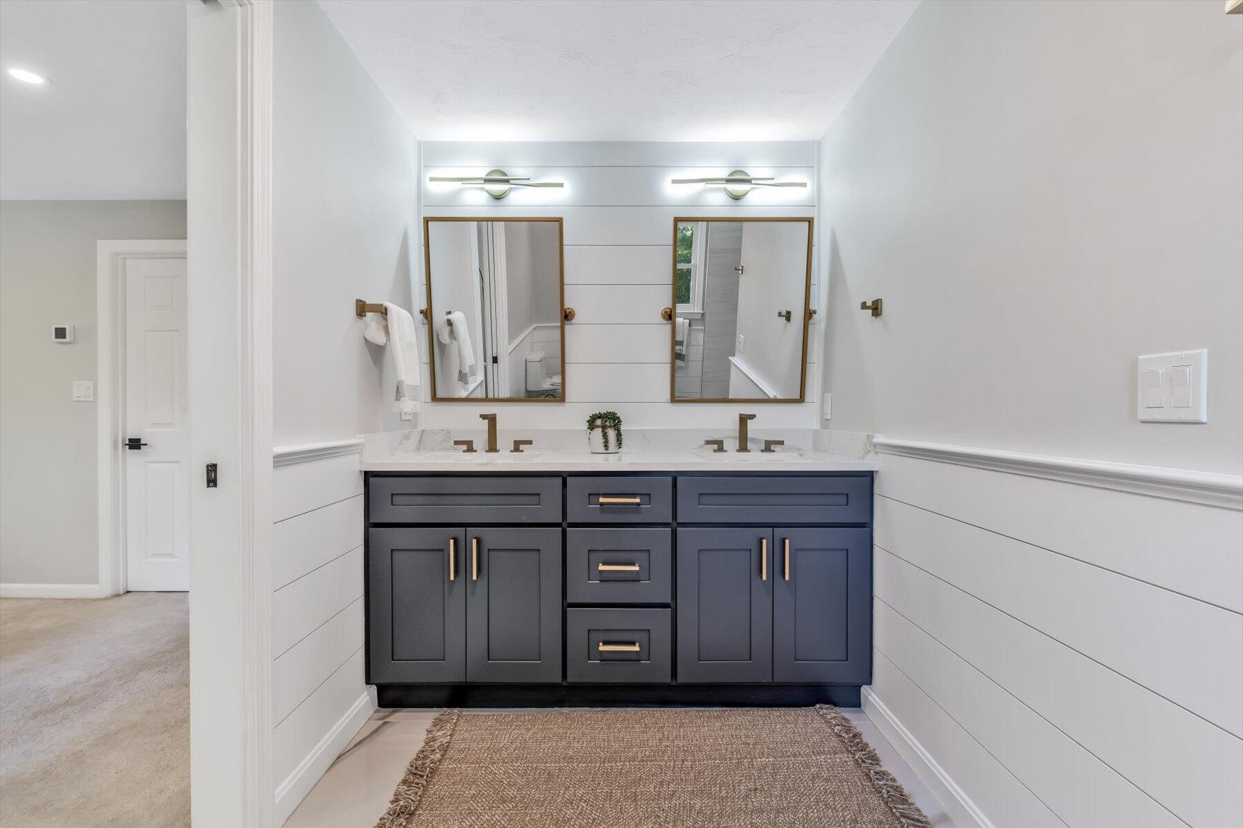 29 Fish House Road East Sandwich, MA 02537 - Photo 25 of 50 a bathroom with a double vanity sink and a mirror