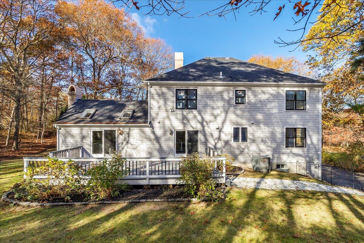 29 Fish House Road East Sandwich, MA 02537 - Photo 41 of 50 a front view of a house with a yard