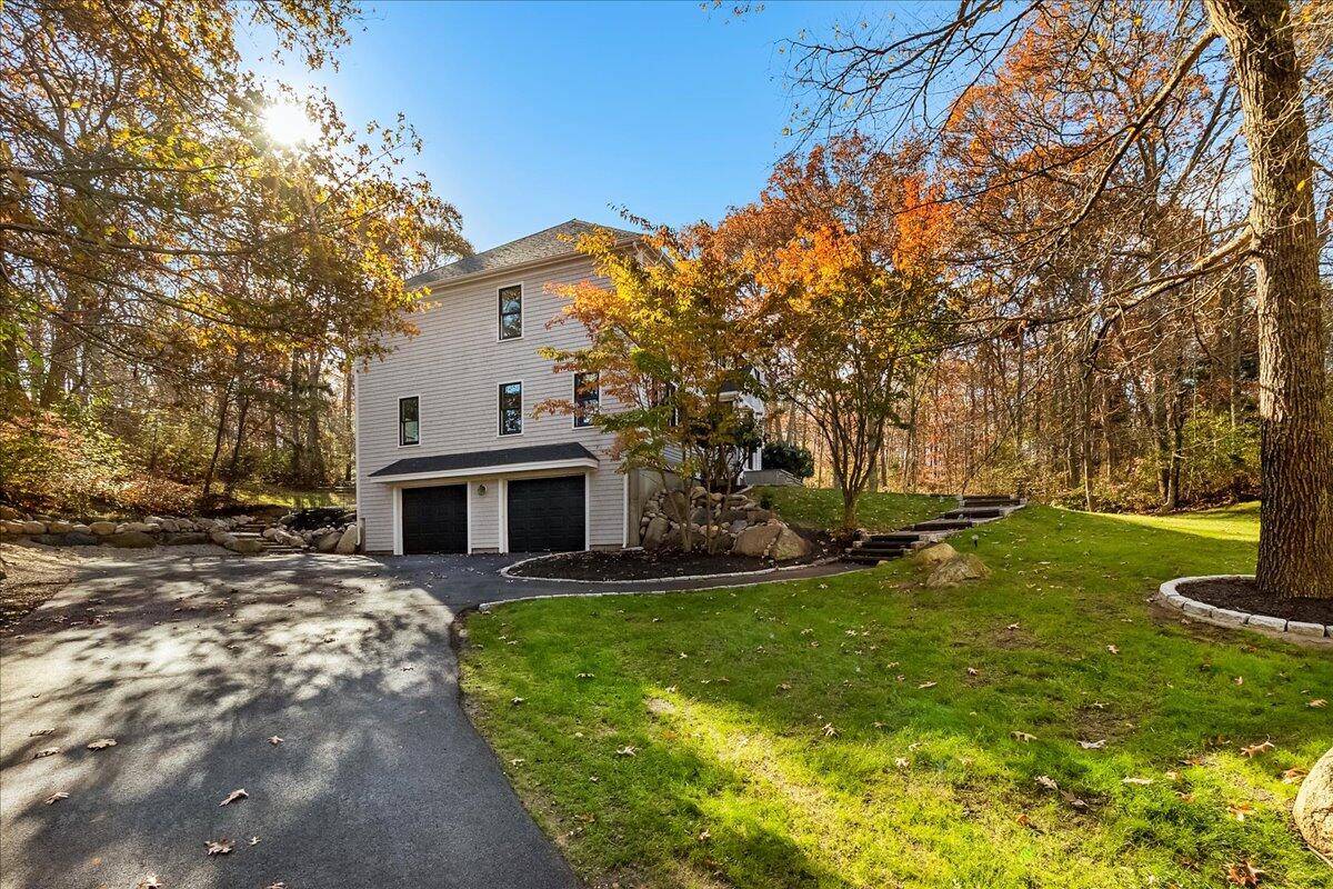 29 Fish House Road East Sandwich, MA 02537 - Photo 44 of 50 a front view of a house with garden