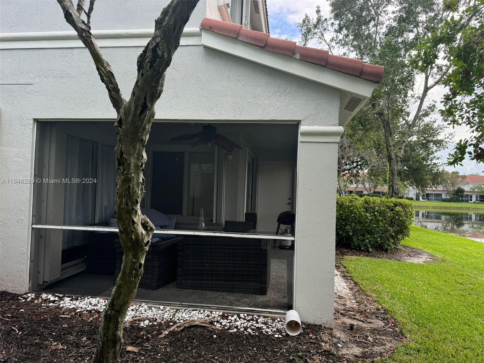 8111 Big Pine Way Riviera Beach, FL 33407 - Photo 5 of 26 SIDE OF STRUCTURE