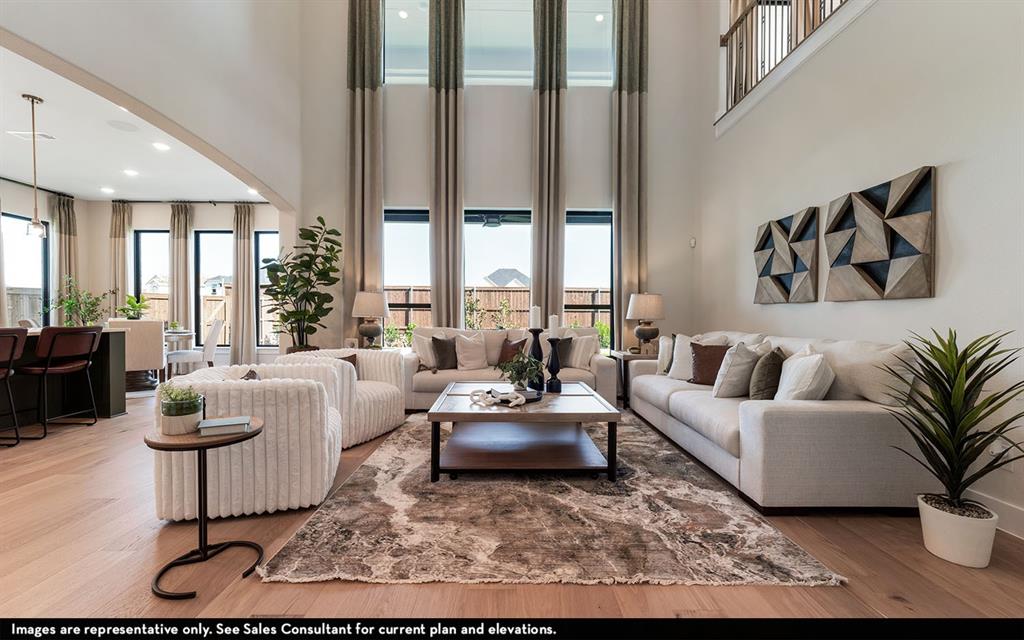 16301 Flatlands Way Celina, TX 75009 - Photo 12 of 39 a living room with furniture and a large window