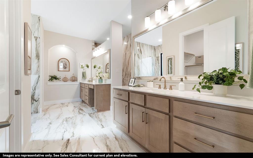 16301 Flatlands Way Celina, TX 75009 - Photo 28 of 39 a spacious bathroom with a sink and a mirror