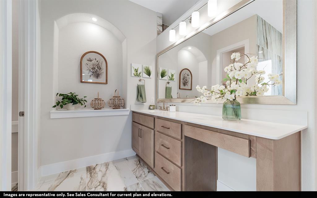 16301 Flatlands Way Celina, TX 75009 - Photo 29 of 39 a bathroom with a sink a vanity and a mirror