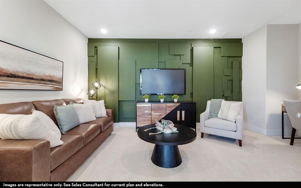 16301 Flatlands Way Celina, TX 75009 - Photo 34 of 39 a living room with furniture a flat screen tv and a large window